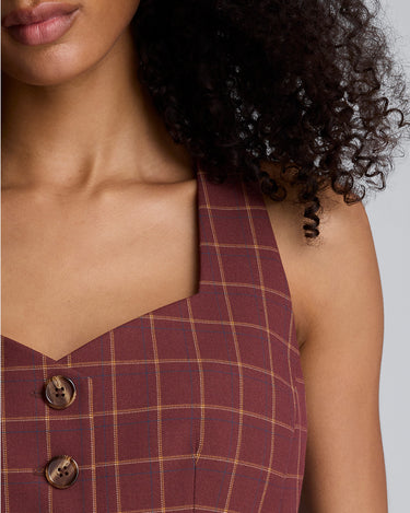Chaleco peplum de corte curvo con cuatro botones para mujer