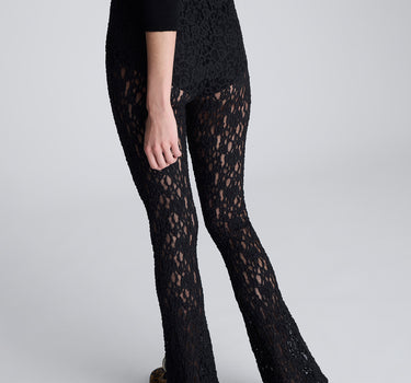 Pantalón acampanado con cintura elastica y short interno para mujer